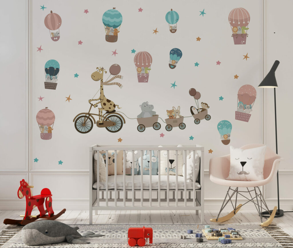 Žirafa na biciklu i baloni